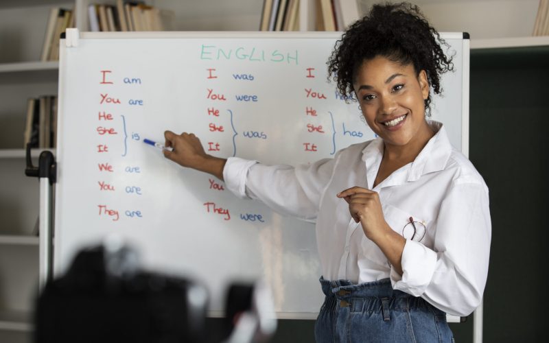 medium-shot-smiley-woman-teaching